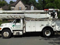 Stump Grinders Tree Service, Inc. Crane Truck